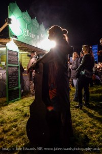 Atmosphere at Festival No.6 on 04/09/2015 at Portmeirion, Gwynedd, North Wales. A musician waits in a food queue at night.
