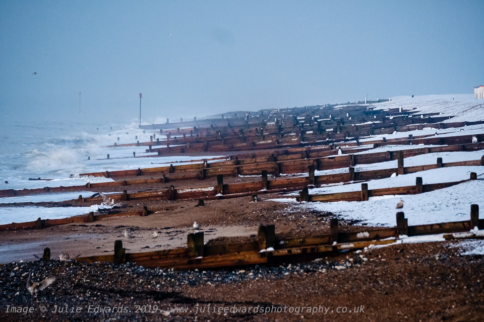 Snow meets the sea on at beach as Snow hits the South East of the UK on Friday 1 February 2019